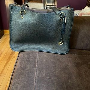 Coach Black with gold hardware.